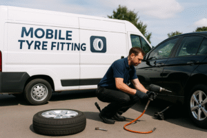 there is a van and there is a guy fixing car tyre